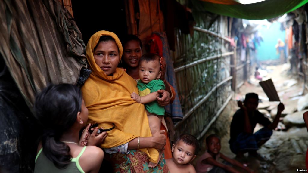 Rohingya refugees are seen outside their makeshift tent in the Kutupalong camp, Cox's Bazar, Bangladesh, Aug. 24, 2018.