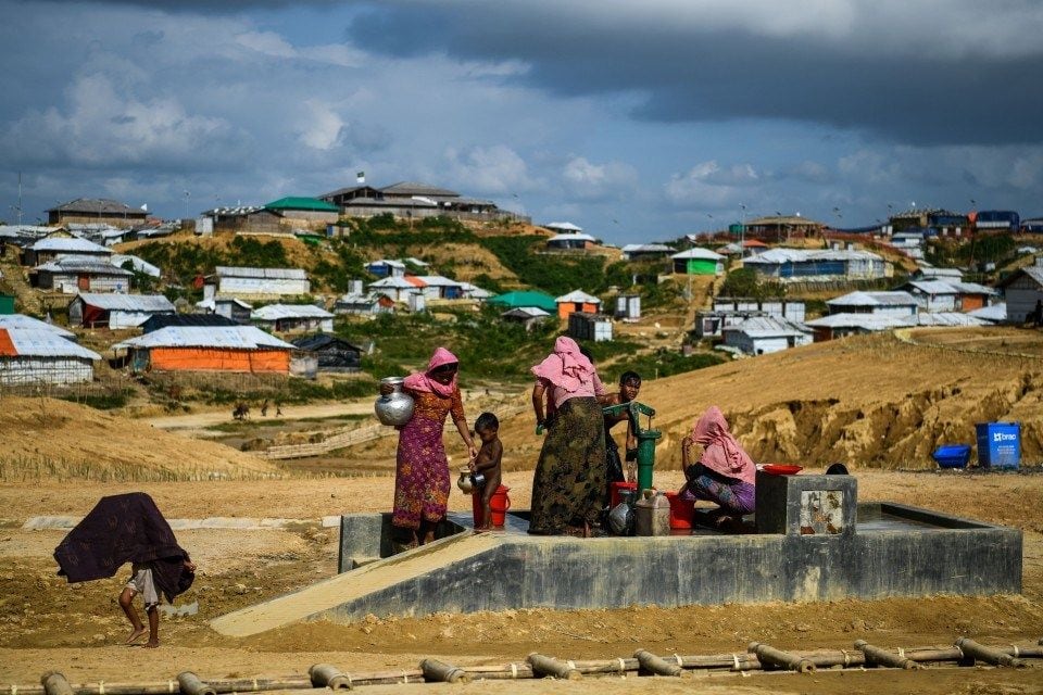 Rohingya refugees collect water at the Kutupalong refugee camp in Ukhia, Bangladesh, on Aug. 8. (Chandan Khanna/AFP/Getty Images)