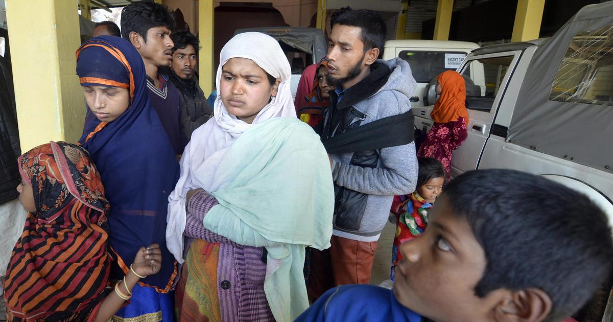 Rohingya Muslims who were stranded on the India-Bangladesh border for four days, seen at a police station in Karimganj district on Tuesday. | PTI Photo