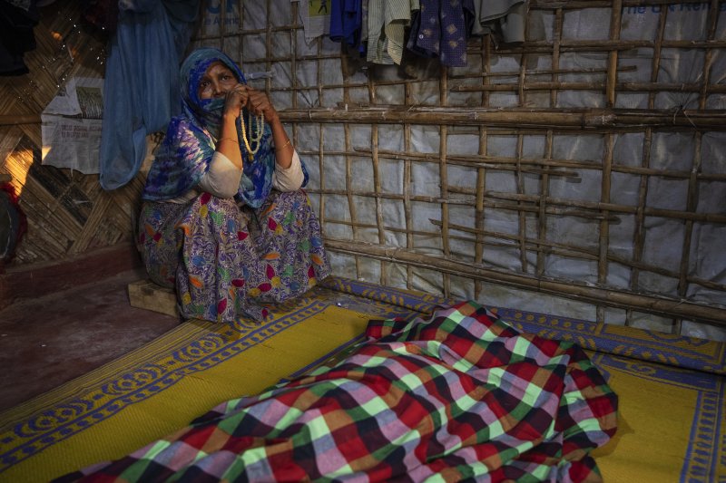 A woman grieves for Fatema Begum, 60, in the hut of the deceased. (Photo: James Nachtwey for TIME)