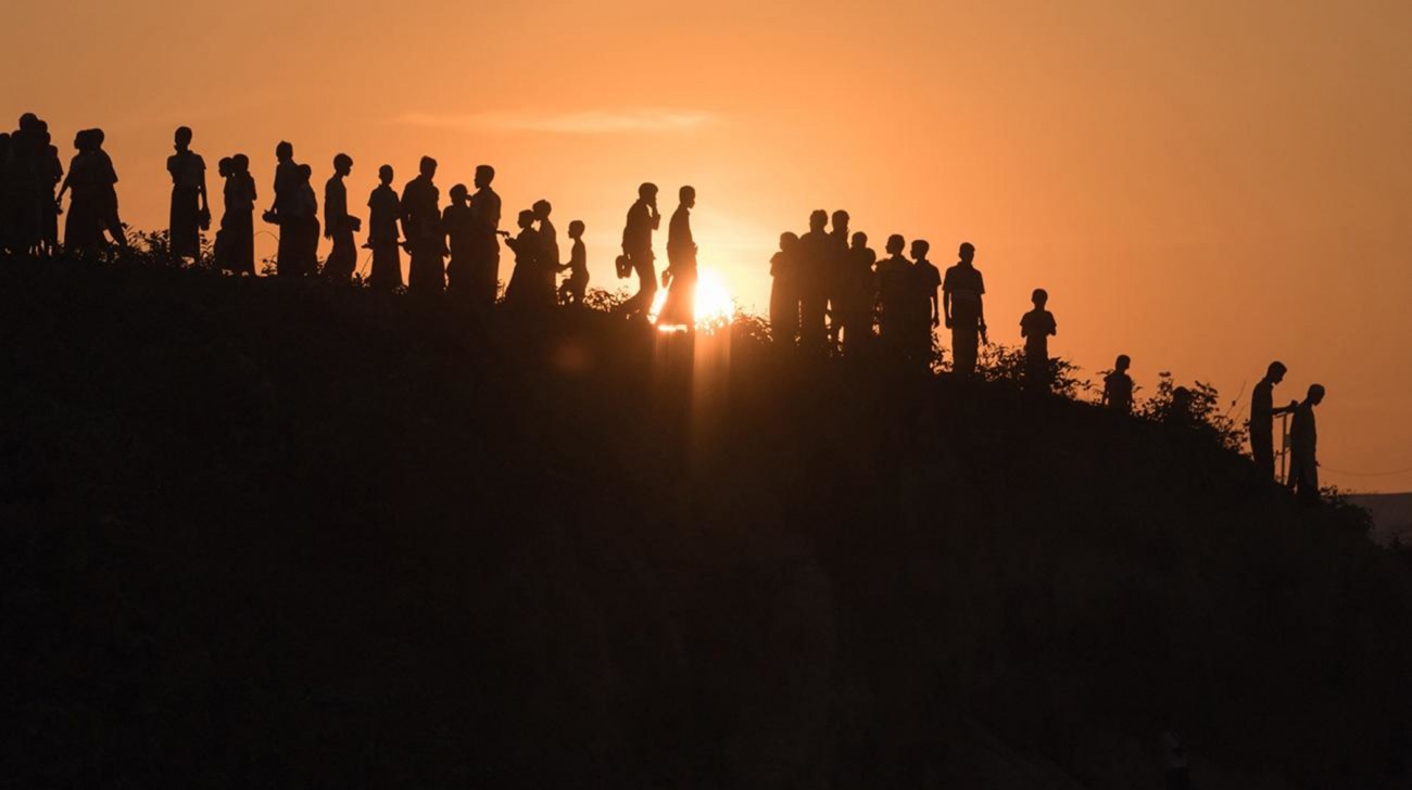 Rohingya refugees walk down a hillside at the Kutupalong refugee camp in Cox’s Bazar on November 27, 2017. PHOTO: AFP