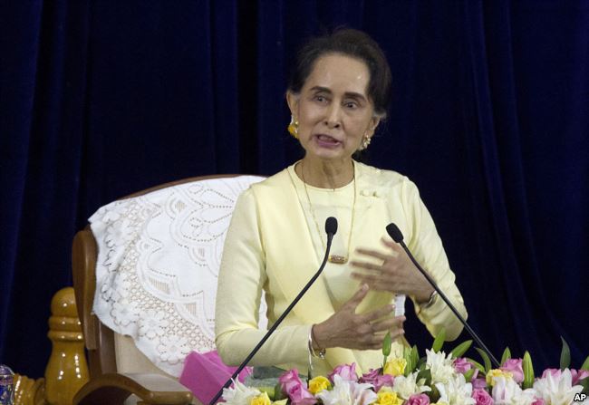 Myanmar leader Aung San Suu Kyi speaks at the convocation hall of Yangon University, Aug. 28, 2018, in Yangon, Myanmar.