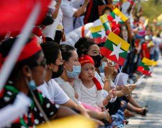 Myanmar citizens living in Thailand protest against the military coup in their country in front of the UN office in Bangkok, Thailand on March 7, 2021 [Reuters/Soe Zeya Tun]